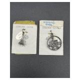 Pair of vintage 1970s Kings Dominion charms.
