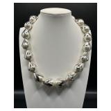 Faux pearl silver tone necklace.