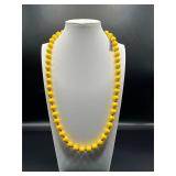 Yellow beads necklace.