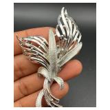 Vintage marked silver tone brooch pin.