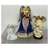3 vintage angel figurines, tallest one is a music