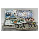8 license plates, Arkansas, Oklahoma, Florida