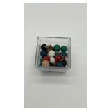 29 colorful marbles, 2 antique jacks