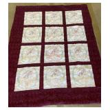 Vintage block quilt with embroidered prayer hands