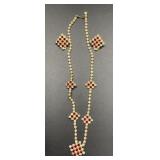 Gold tone and red necklace with clip on earrings.