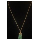 14k gold and jade carved pendant on 14k necklace