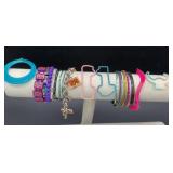 26 Bracelets and a necklace pendant.