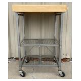 Wood and metal rolling table that folds up. 26x37