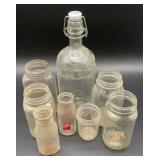 8 vintage glass bottles and jars, a clear glass