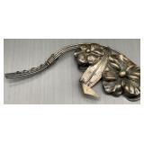 Vintage sterling silver floral brooch featuring a