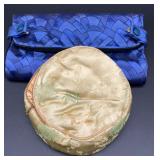 Vintage cosmetic bag gold in color with a branch