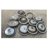 11 vintage automobile hubcaps, Oldsmobile, 16 x