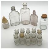 15 glass bottles, 12 have lids