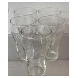 5 Coca Cola glasses, 5 tall 3 wide, most have