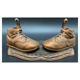 Vintage bronzed baby shoes mounted on stand, 12x6