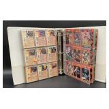 Binder of mixed baseball and football cards, some