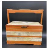 Vintage wooden sewing box featuring a tapestry