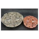2 Vintage flower frogs. Larger one is clear glass