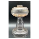 Antique glass lamp base, glows under black l