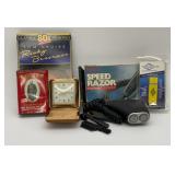 Vintage luminous folding travel alarm clock in a