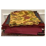 32 placemats and 2 table runners, the quilted