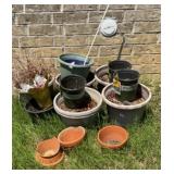 Plastic flower pots and 2 clay pots