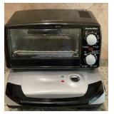 George Forman black and silver grill. Powers on.