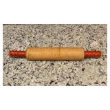 Vintage wooden rolling pin with orangish/Red
