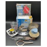 Vintage Swing-A-Way can opener with blue handles,