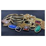 Vintage gold tone jewelry. 3 Brooches, abstract