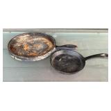 2 cast iron griddle pans, larger one is 8 inches
