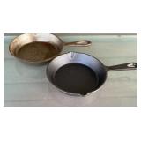 2 cast iron skillets, 6 5/8 inches wide