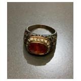 Red-Orange Faceted Gemstone & Diamond-Tested Halo