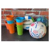Volleyball, soccer balls and buckets