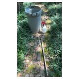 Trash can, sprayer, hand ax and spade