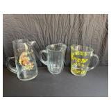 Three Glass Pitchers with Unique Designs