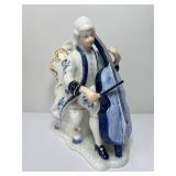 vintage porcelain figurine depicting a musician