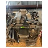 Shelf full of Stainless pans