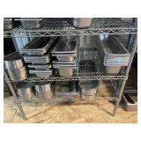 Shelf full of Stainless pans