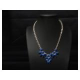 Silver tone necklace with blue beads