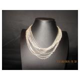 Multi strand silver tone necklace