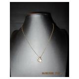 Gold tone necklace with gold heart with diamond...