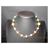 Chocker with silver, bronze, green and gold beads