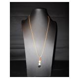 Rope necklace with beads hanging down