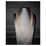 6 chains make up this nice gold tone necklace