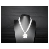 White seed beads with a shell flower pendent