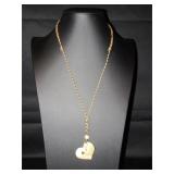 Gold colored heart with a heart in the middle