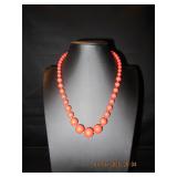 Red graduated bead necklace