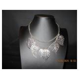 Silver tone necklace with leaves