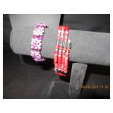 2 bracelets One purple gems and the other is a...
